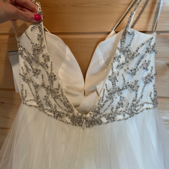 Elegant White Wedding Dress with Silver Embellishments - Picture 4 of 11